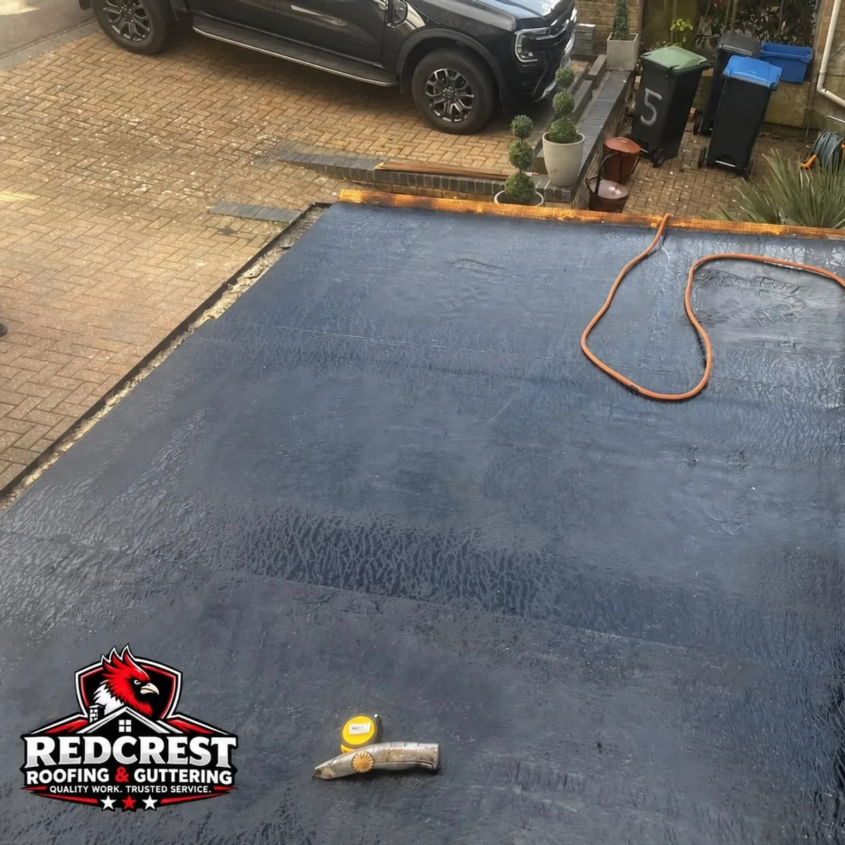 Flat roof and driveway