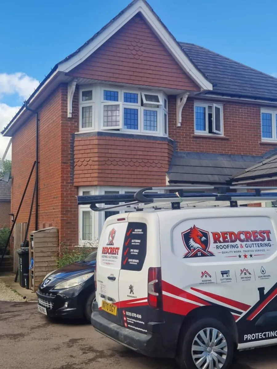 Redcrest roofers working on a pitched roof