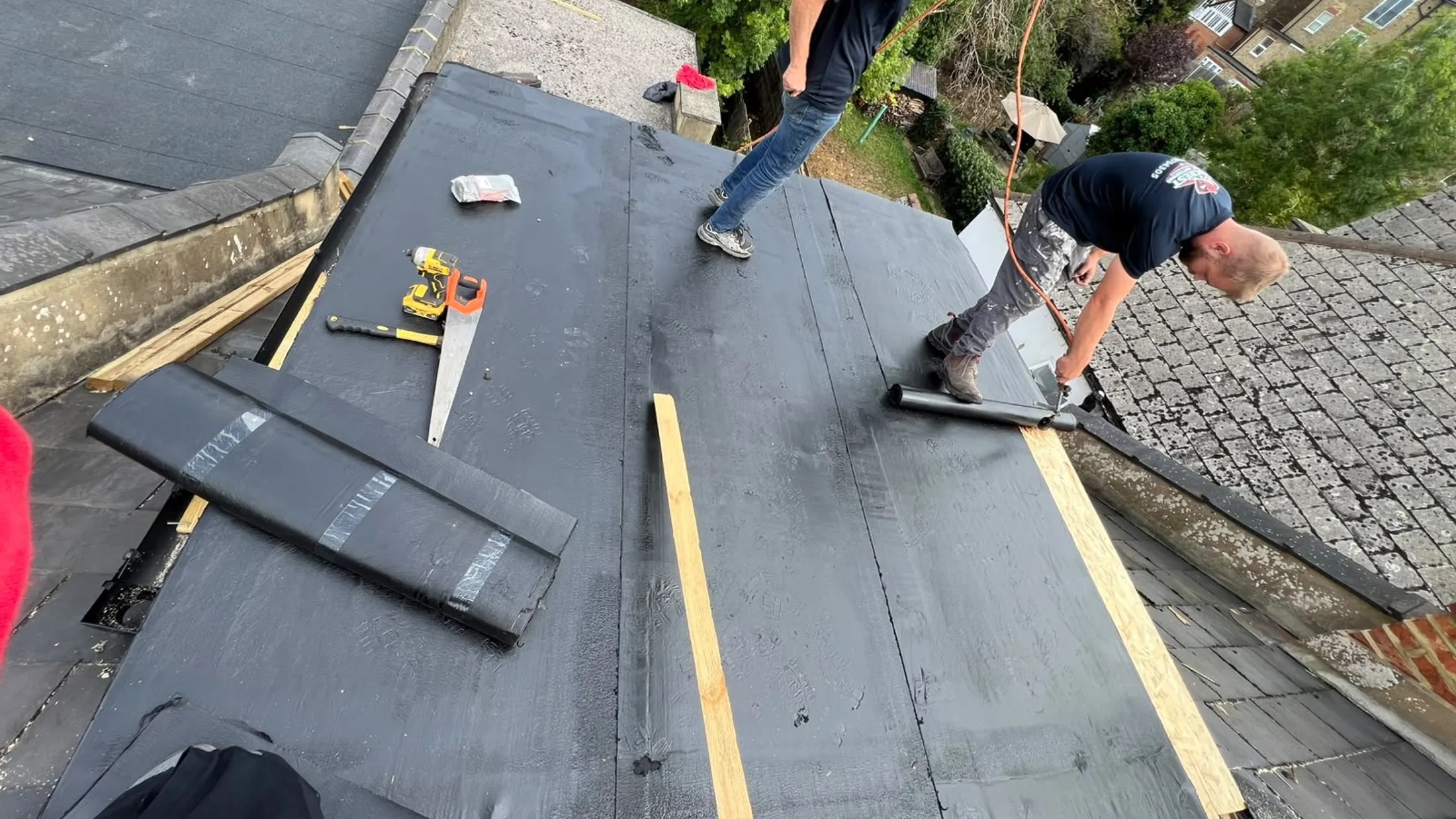 The Redcrest team in uniform re-roofing a house