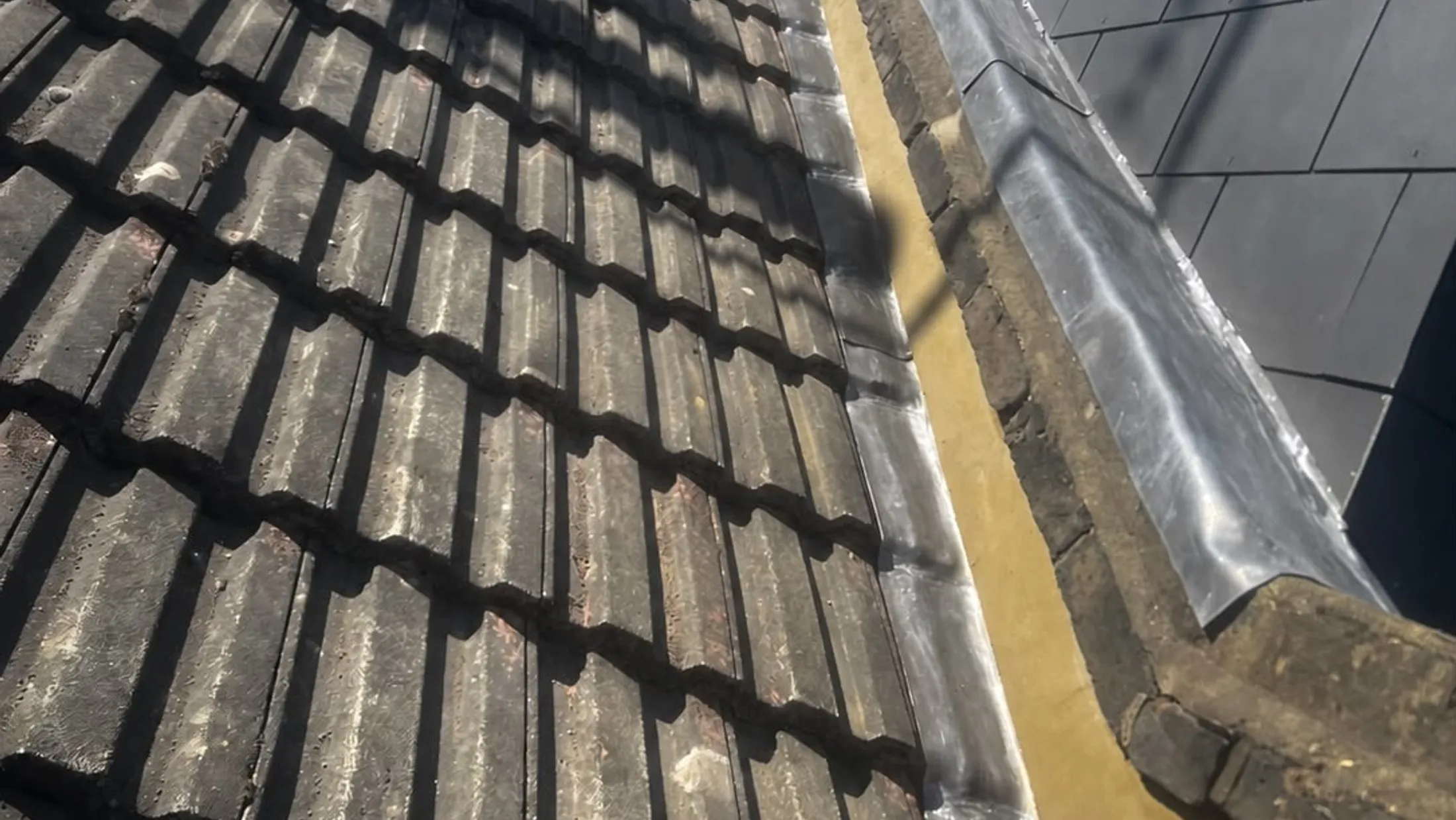 A finished tiled roof with new leadwork by Redcrest Roofing & Guttering